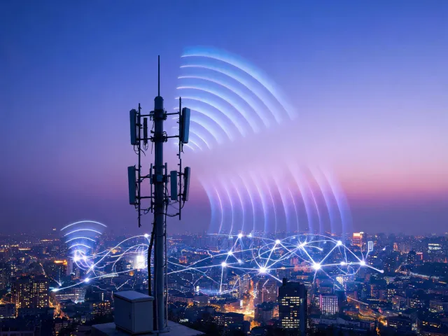 Antenna tower silhouette and wireless city